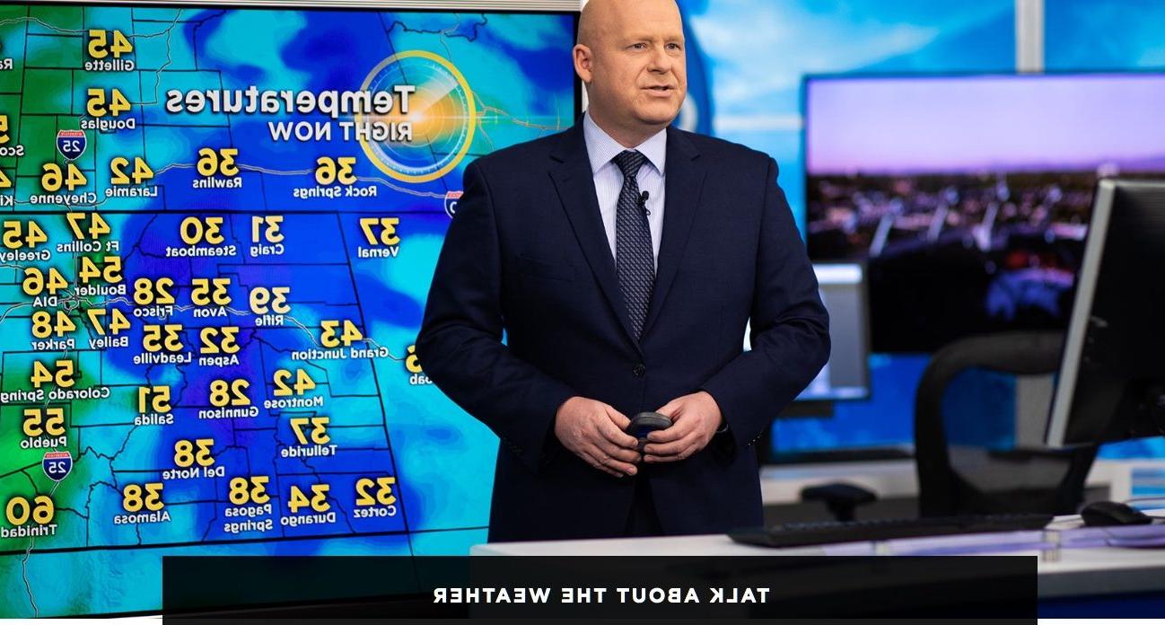 Image of tv meteorologist Chris Spears in a studio standing in front of a Colorado temperature map